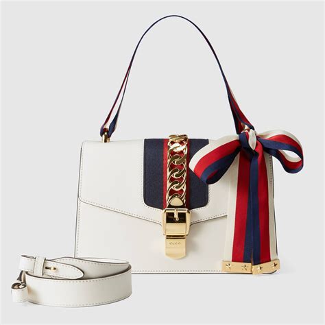 gucci erkek|white Gucci bag.